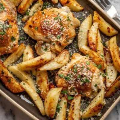 sheet pan garlic and parmesan chicken thighs with potatoes