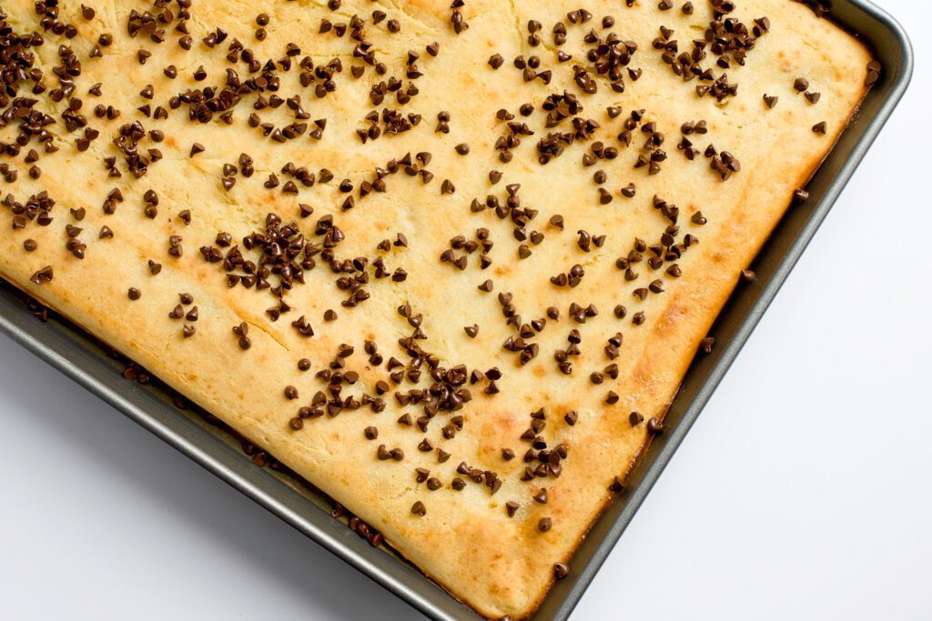 baked sheet pan pancake with mini chocolate chips sprinkled over the top