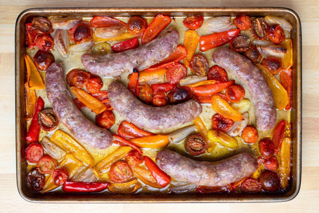 roasted sheet pan sausages with peppers and tomatoes