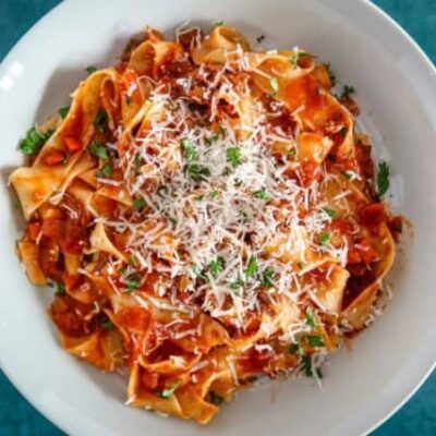 short rib bolognese sauce with pasta and parmesan