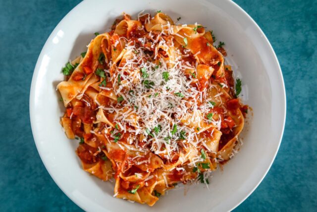 short rib bolognese sauce with pasta and parmesan