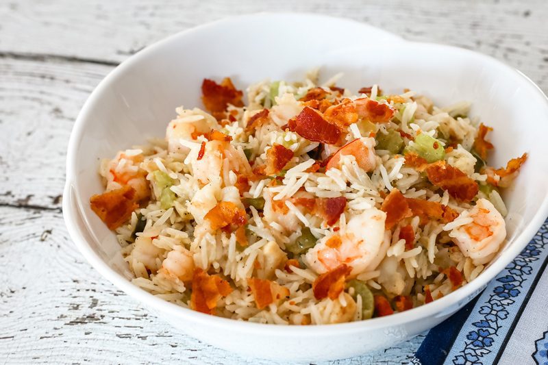 shrimp, chicken, and bacon rice pilaf in a serving bowl