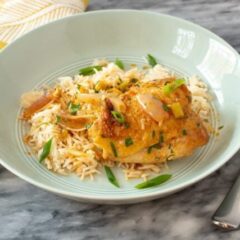 easy harissa chicken skillet shown with rice