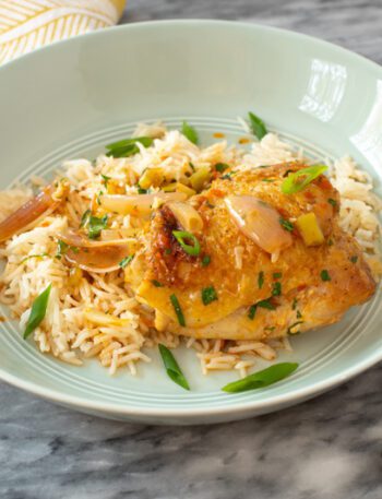 easy harissa chicken skillet shown with rice