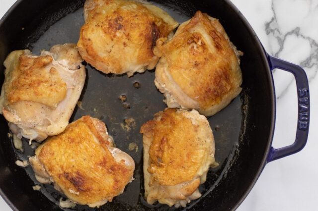 searing the chicken thighs