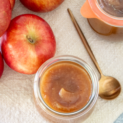 Fresh apples with caramel sauce in a jar.
