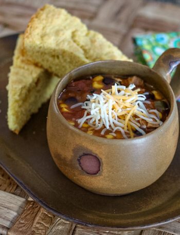 slow cooker chicken enchilada soup and cornbread on a serving tray