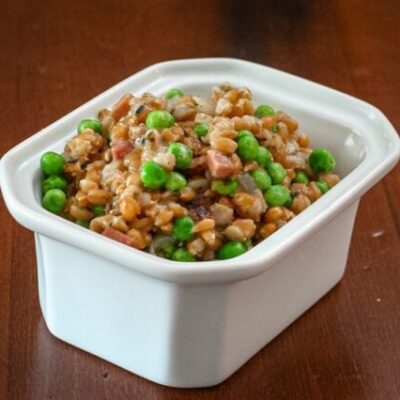 slow cooker farro pilaf in a serving dish