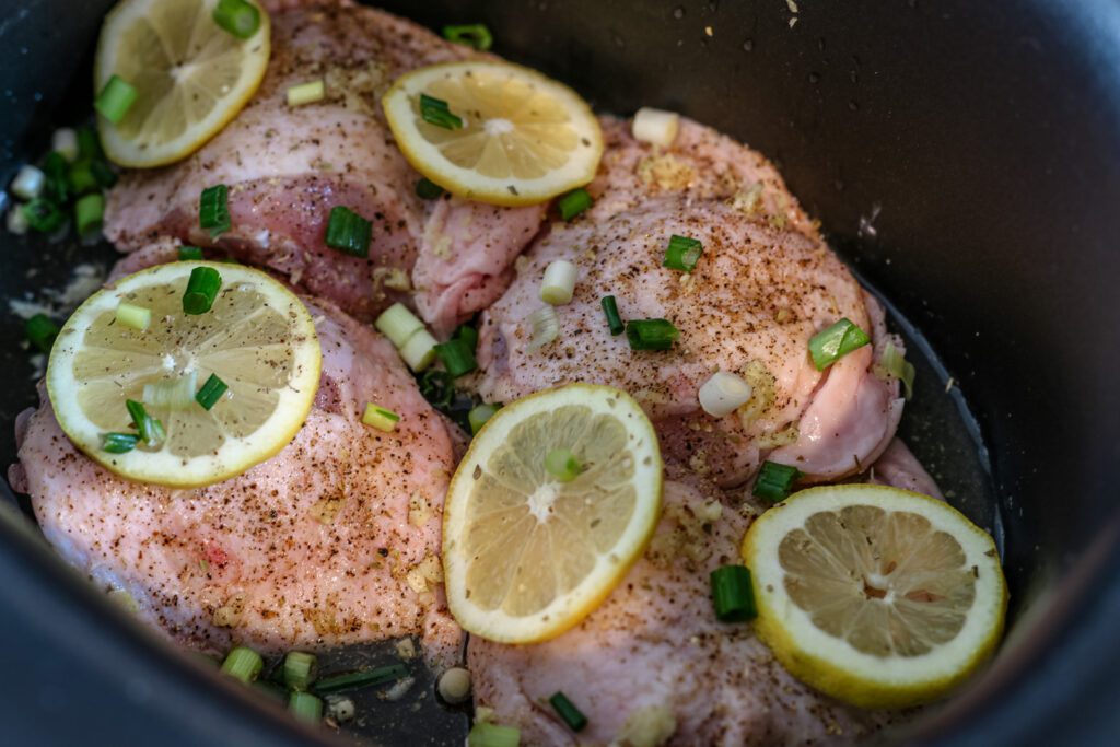 chicken thighs with lemon, garlic, and green onions in the slow cooker
