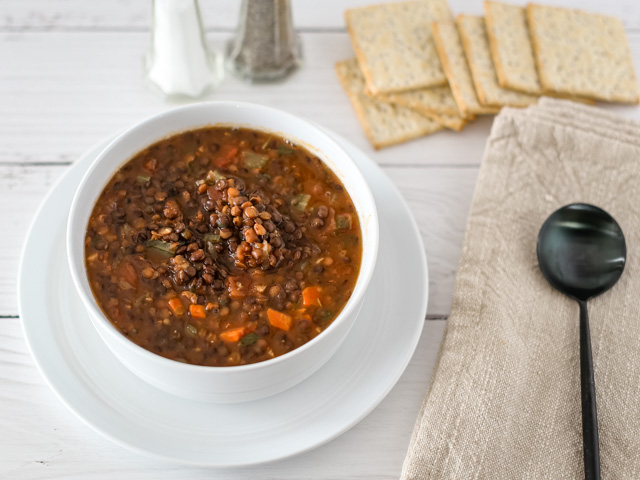 Bowl of lentil soup not garnished.