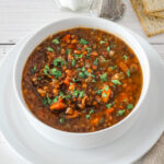 A bowl of slow cooker lentil soup.