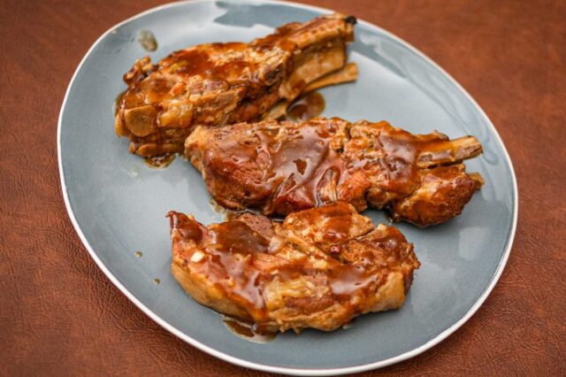 slow cooker marmalade spareribs on a serving plate