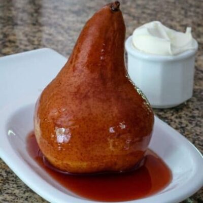 slow cooker wine poached pear on a serving dish