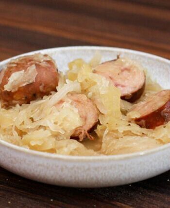 smoked sausages, sauerkraut, and apple meal in a bowl, cooked in the slow cooker