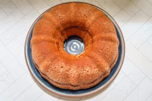 Invert the cake onto a rack or plate.