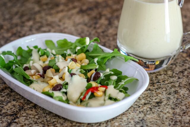 sour cream dressing on a small salad