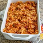 A serving dish with Spanish rice.