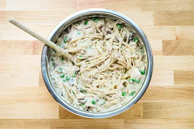 Combining ingredients for chicken tetrazzini.