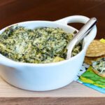 spinach and artichoke dip in a small baking dish