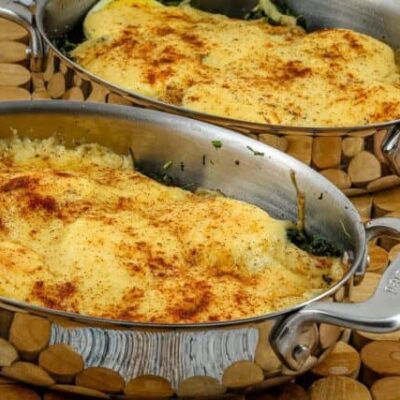 spinach casserole with cheese, hard-boiled eggs, and bacon