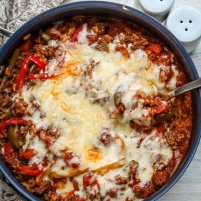 Stuffed pepper casserole with melted fontina cheese, a one pot meal made in a skillet and baked.