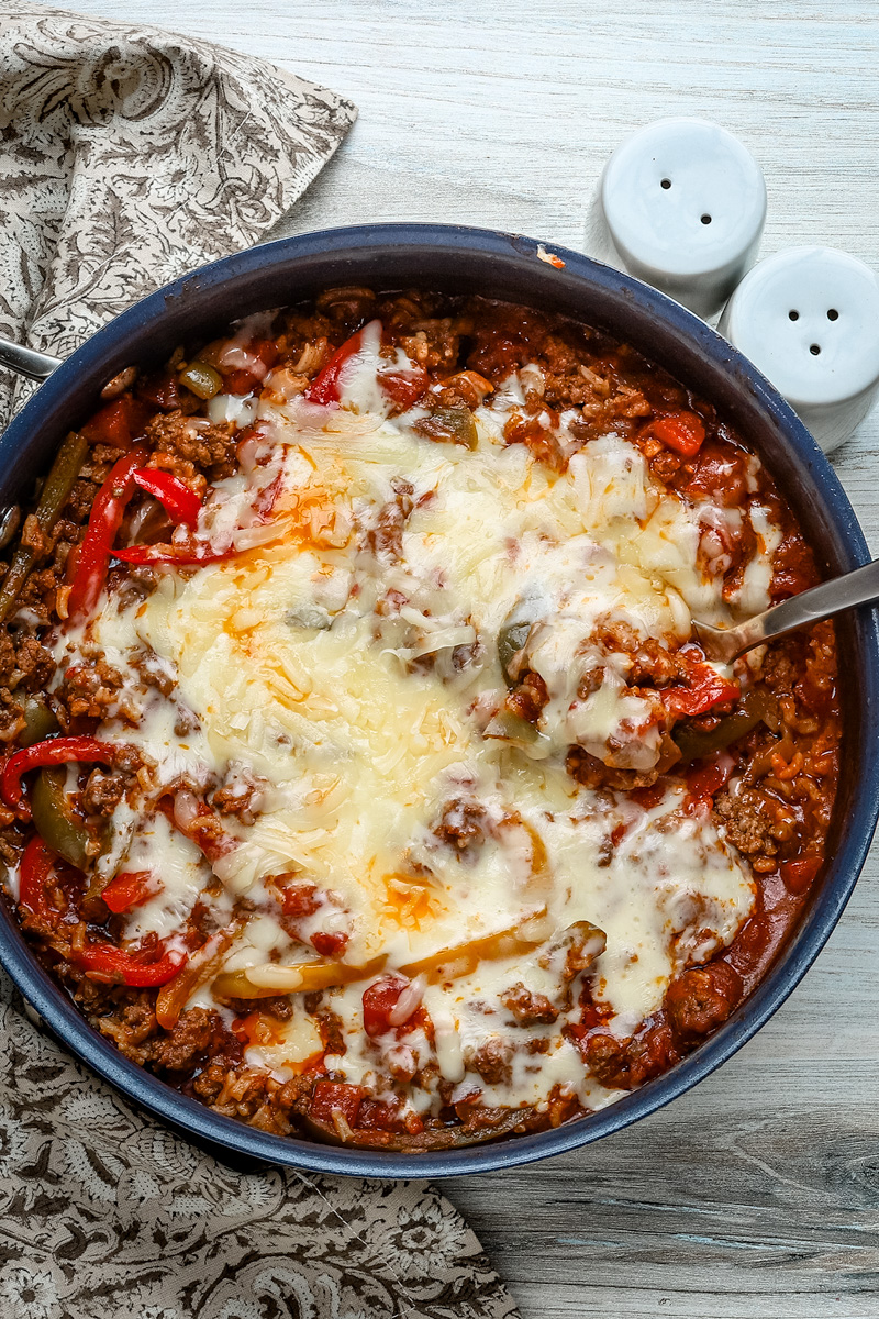 Stuffed pepper casserole with melted fontina cheese, a one pot meal made in a skillet and baked.