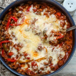 Stuffed pepper casserole with melted fontina cheese, a one pot meal made in a skillet and baked.