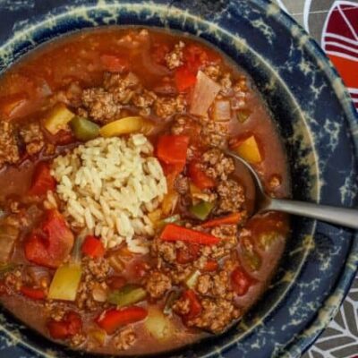 Stuffed pepper soup with ground beef, rice, and tomatoes.