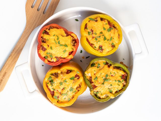 perfectly stuffed peppers with parsley garnish.