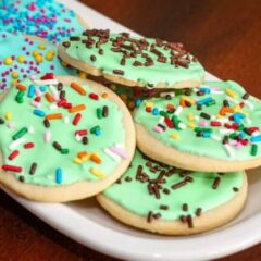 sugar cookies with royal icing on a small plate
