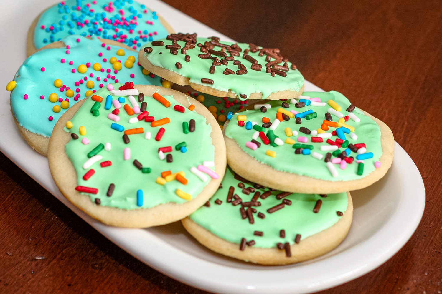 sugar cookies with royal icing on a small plate