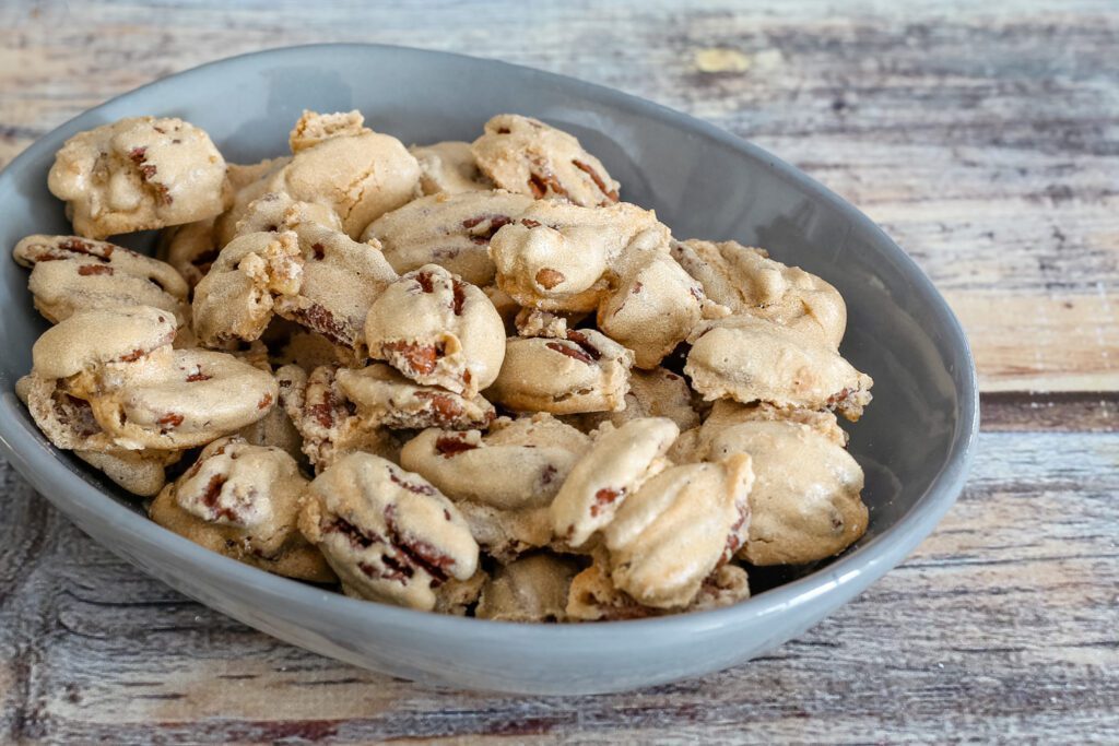 coated sugared pecans in a snack dish