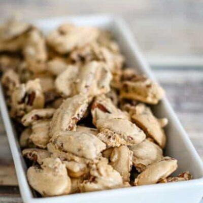 sugared pecans snack in a small decorative dish