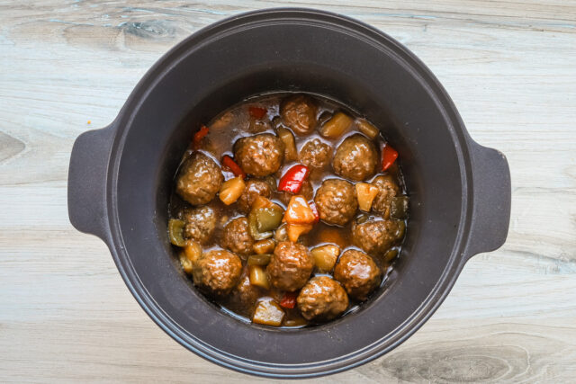 Cooked sweet and sour meatballs in the slow cooker.