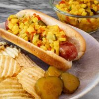 spicy corn relish on a hot dog