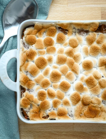 Sweet potato casserole for two in a small baking dish with marshmallow topping.