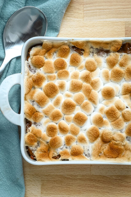 Sweet potato casserole for two in a small baking dish with marshmallow topping.