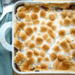 Sweet potato casserole for two prep: baked sweet potato casserole with browned marshmallows, ready to serve.