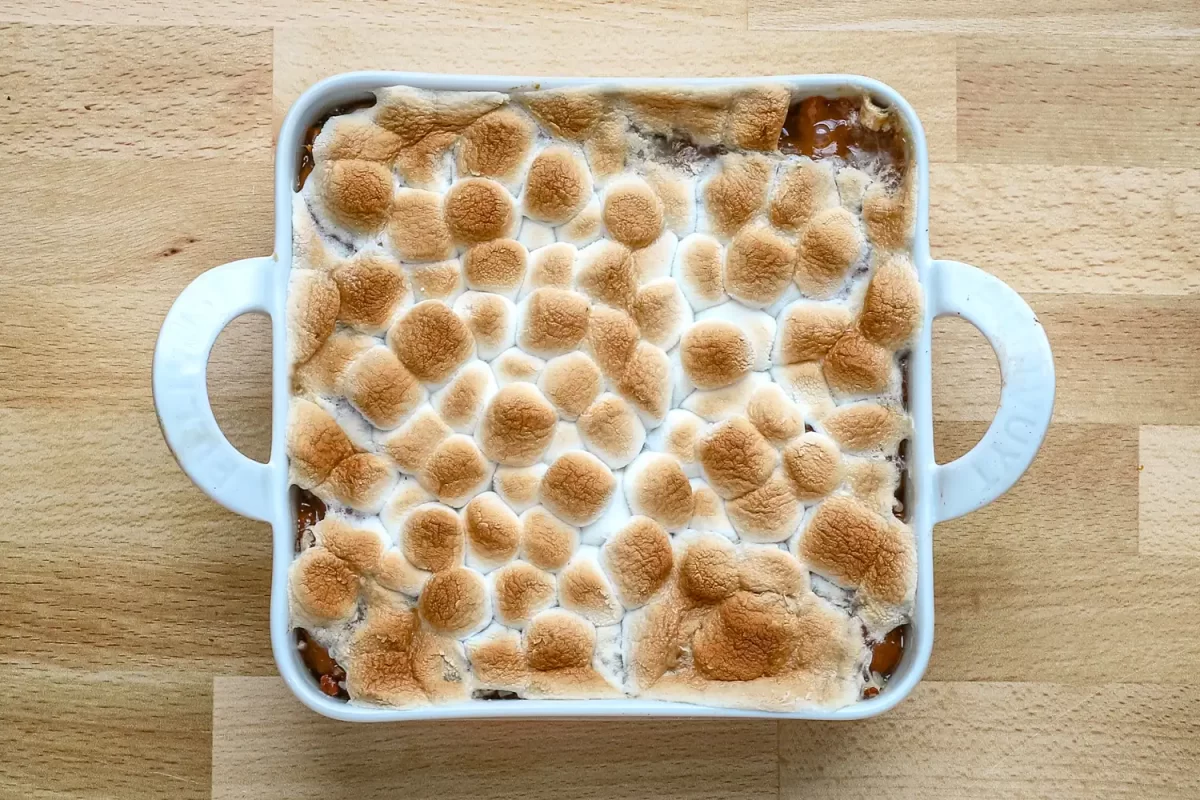 Sweet potato casserole for two prep: baked sweet potato casserole with browned marshmallows, ready to serve.