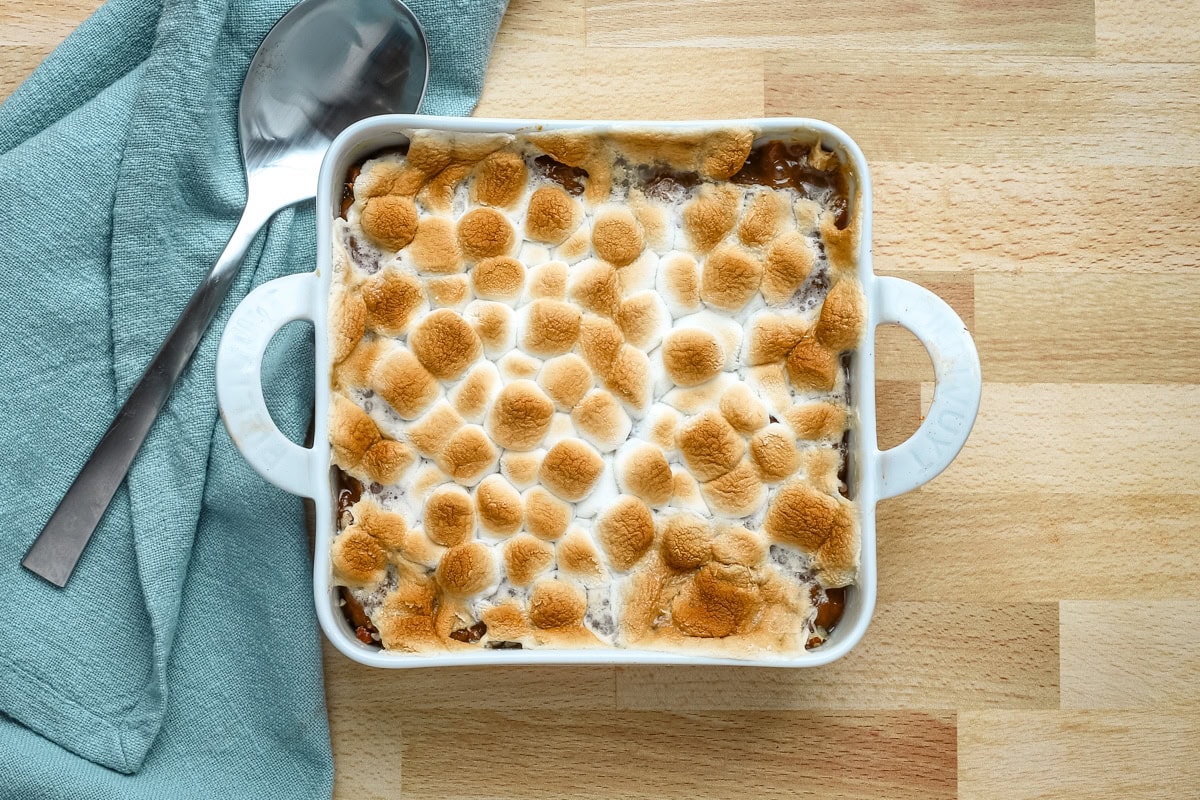 Sweet potato casserole for two prep: baked sweet potato casserole with browned marshmallows, ready to serve.