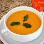 a bowl of roasted sweet potato soup