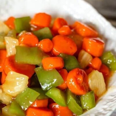 a serving bowl with sweet and sour carrots