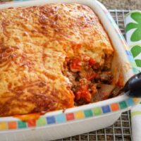 A baked tamale pie with cornmeal topping