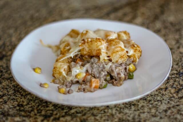Tater tot hotdish serving on a plate.