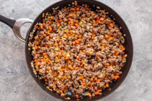 Brown the ground beef with the vegetables.