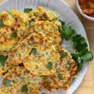 tex mex fritters on a plate with cilantro