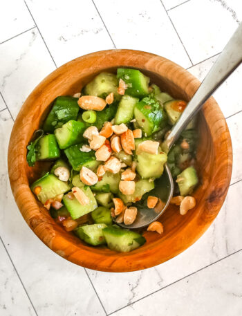 Thai cucumber salad in a bowl with peanuts.