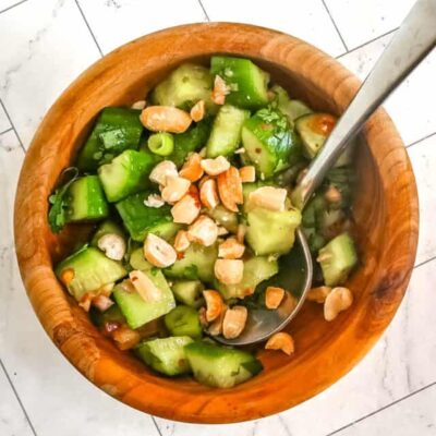 Thai cucumber salad in a bowl with peanuts.