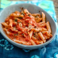 Tomato cream sauce with basil combined with penne pasta.