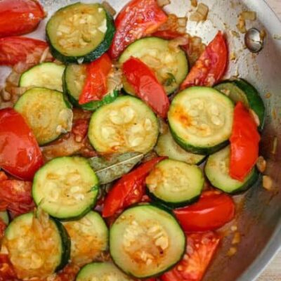 zucchini and tomatoes in a skillet